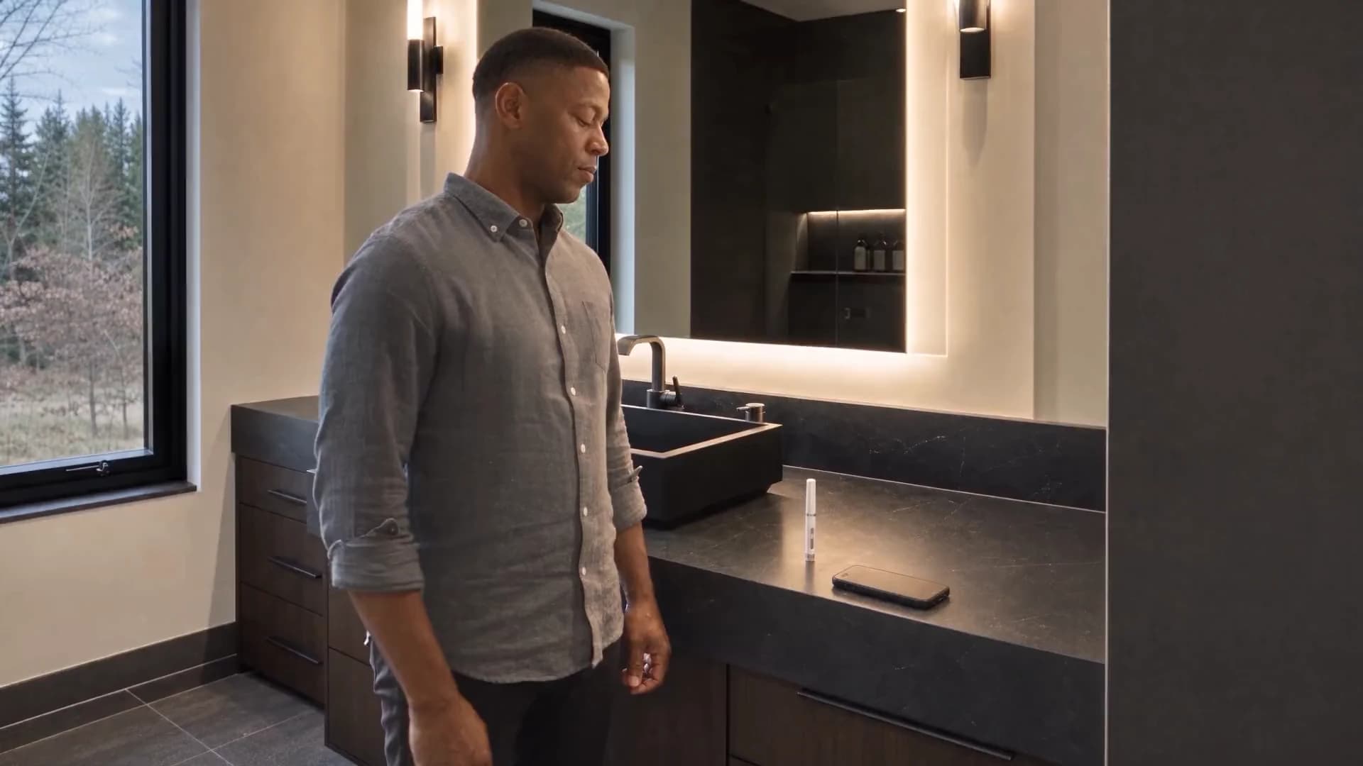 A man at a bathroom counter with his protocol laid out, ready to log a dose in Omnis Body.